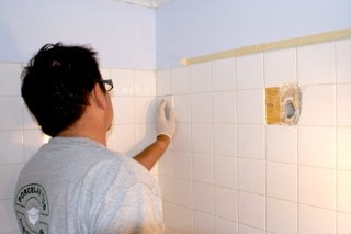 Bathroom ceramic tile repair replacing broken tile.