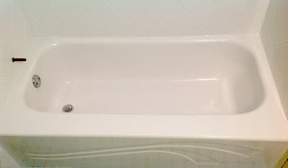 Bathroom remodeling after tub liner installation and acrylic tub surround.