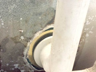 Bathtub drain rust hole repair mated with the tub drain plumbing.