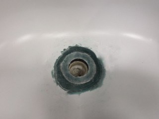 Bathtub drain rust hole repair trimmed up.