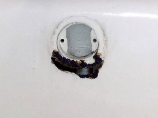 Bathtub overflow rust hole repair.