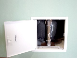 Bathtub plumbing access panel.