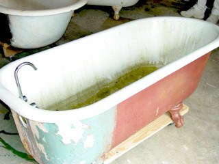 Clawfoot tub multiple coats of leaded paint.