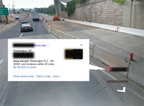 Google map street view showing a company under a bridge