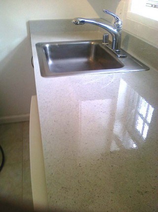 Kitchen countertop getting a brand new look by refinishing.