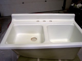 Kitchen sink repair double bowl getting refinishing treatment.