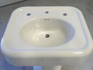 Close up of completed pedestal sink refinishing.