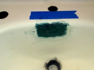 Fiberglass repair to damaged overflow.