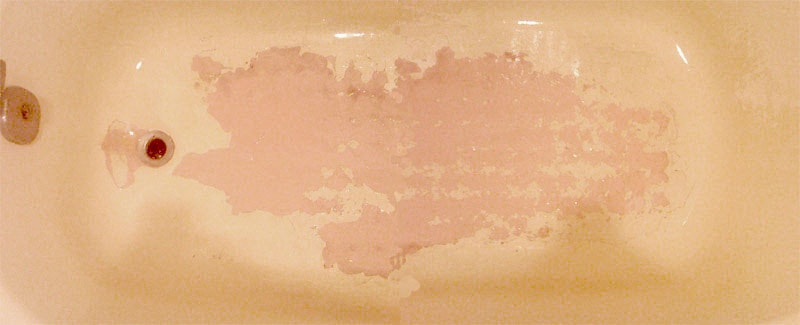 Bathtub refinishing damaged by bathmat left down.